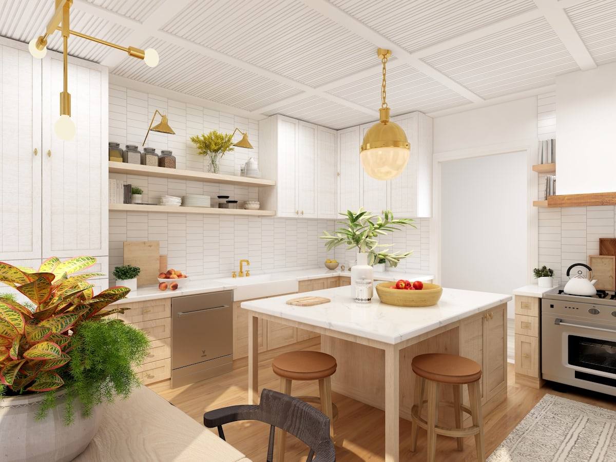 Cuisine blanche avec îlot central et suspension dorée, longère rénovée aux environs de Rennes